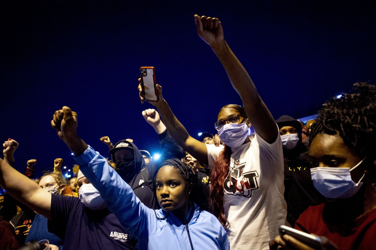 People march at a peaceful protest seeking justice for George Floyd in Flint Township, Michigan.