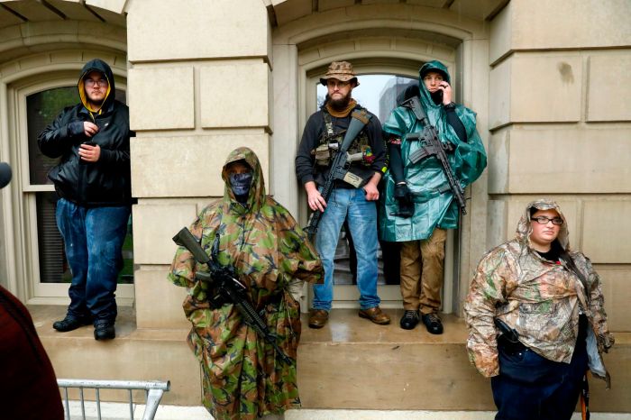 Armed demonstrators in Lansing, Michigan, protest the coronavirus pandemic stay-at-home orders on May 14.